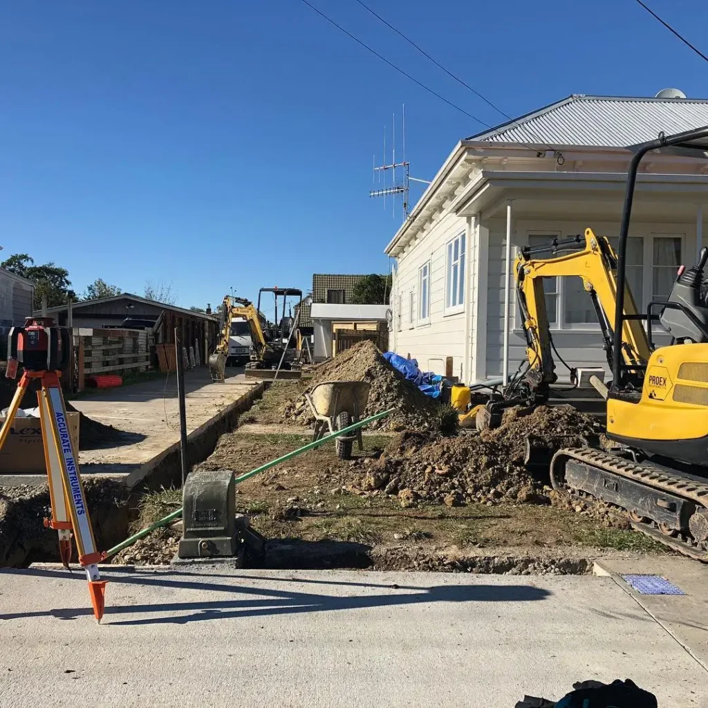 Ground being cleared and prepared for a new concrete driveways — by Manawatu Concrete.