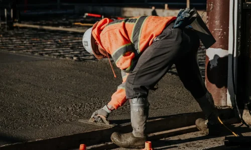 Concrete repairs work in progress, with cracks being filled and surfaces leveled to restore durability and appearance — by Manawatu Concrete. Concrete repairs work in progress, with cracks being filled and surfaces leveled to restore durability and appearance — by Manawatu Concrete.